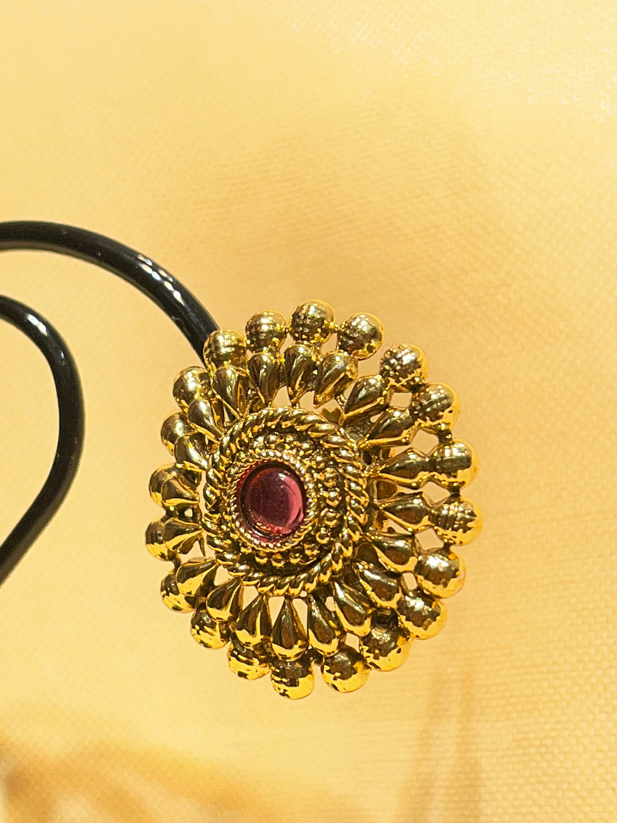 Gold toned traditional floral stud earrings