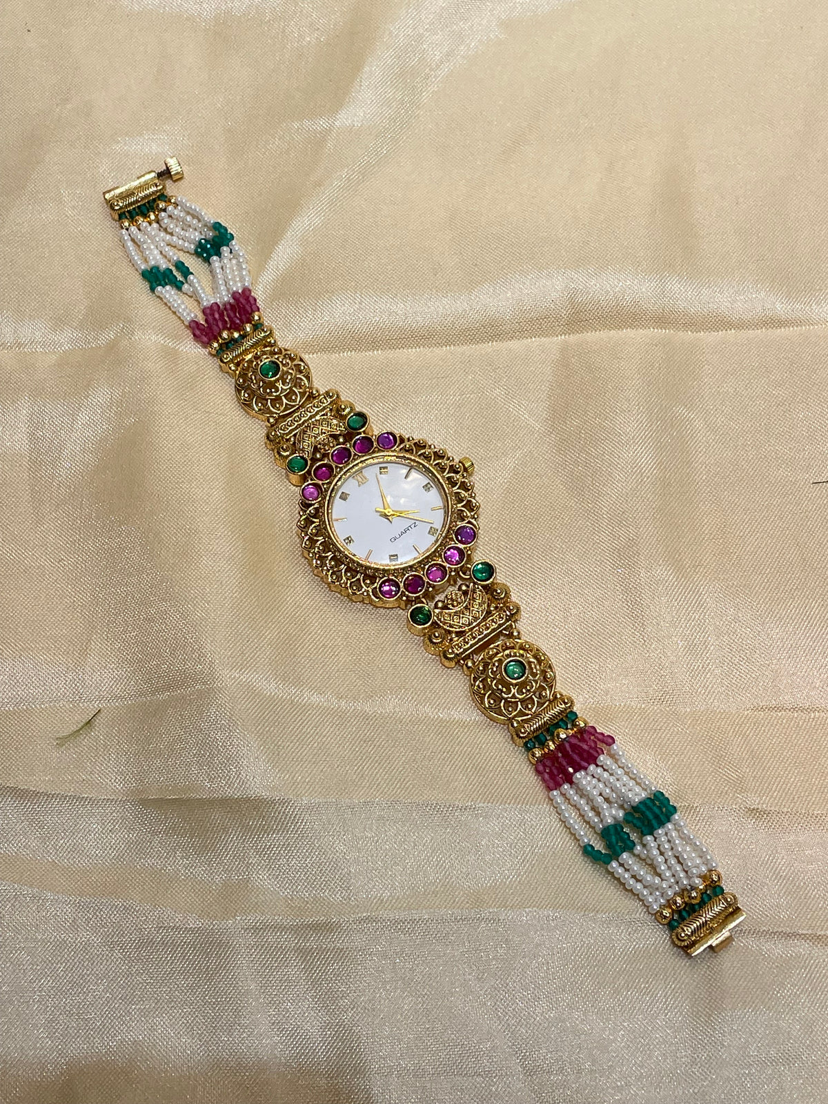 Antique gold  pearl and emerald Kundan watch
