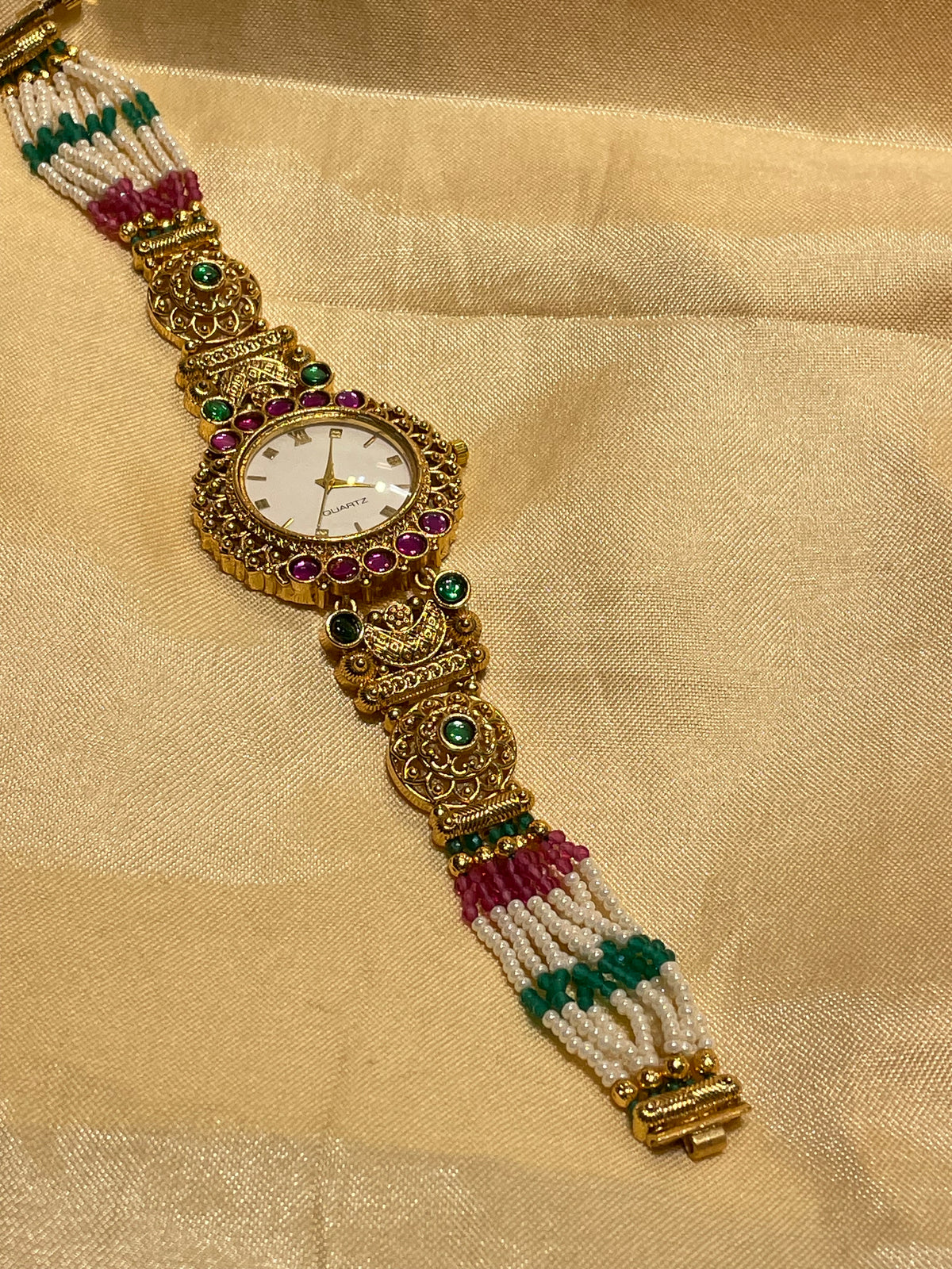 Antique gold  pearl and emerald Kundan watch